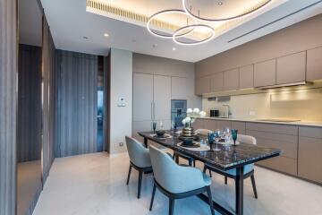 Modern dining room and kitchen with elegant lighting