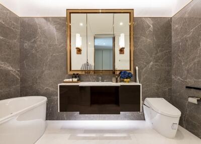 Modern bathroom with marble walls and sleek fixtures