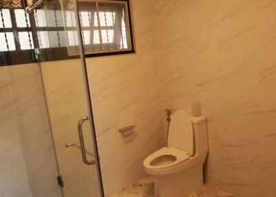 Bathroom with glass shower enclosure and modern lighting