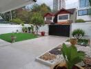 Spacious backyard with garden and paved area