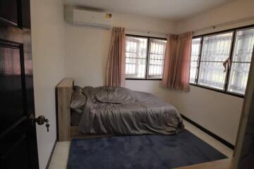 Bedroom with a bed, rug, and air conditioning