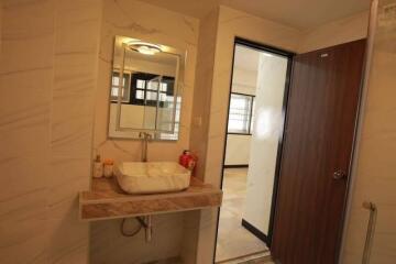 Modern bathroom with sink and large mirror