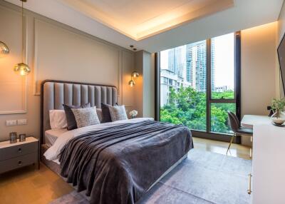 Modern bedroom with large window and city view