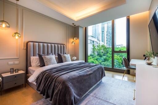 Modern bedroom with large window and city view