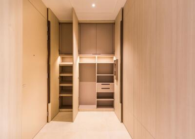 Spacious storage closet with ample shelving and cabinetry