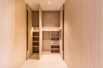 Spacious storage closet with ample shelving and cabinetry