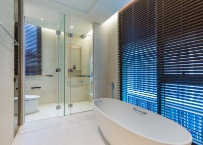 Modern bathroom with freestanding tub and glass-enclosed shower