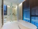 Modern bathroom with freestanding tub and glass-enclosed shower