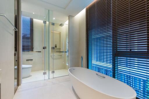 Modern bathroom with freestanding tub and glass-enclosed shower