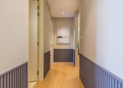 Modern hallway with wooden flooring and tasteful decor