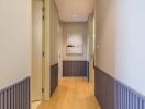 Modern hallway with wooden flooring and tasteful decor