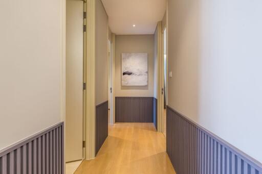 Modern hallway with wooden flooring and tasteful decor