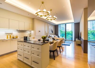 Modern open plan kitchen and living area with dining table