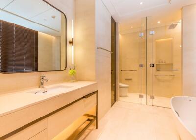 Modern bathroom with large mirror and glass shower