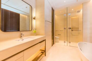 Modern bathroom with large mirror and glass shower