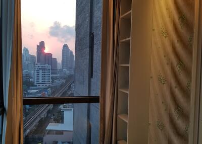 High-rise bedroom with city view