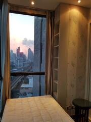 High-rise bedroom with city view