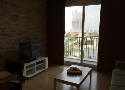 Cozy living room with TV and a city view