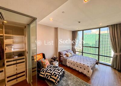 Bright modern bedroom with large windows and city view