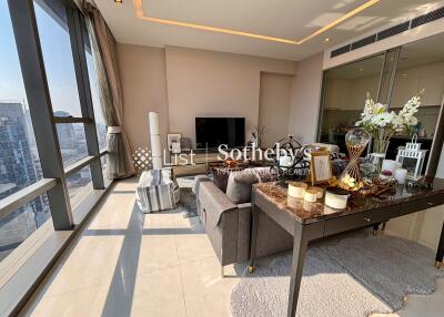 Modern living room with large windows and city view