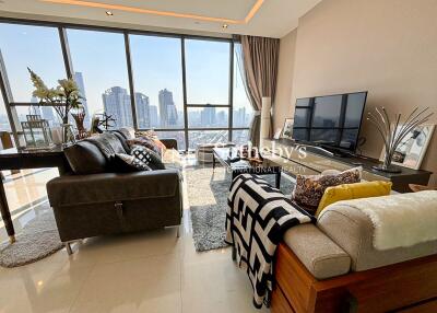 Modern living room with large windows and city view