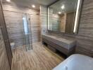 Modern bathroom with double sinks and glass shower enclosure