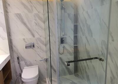 Modern bathroom with glass shower and toilet