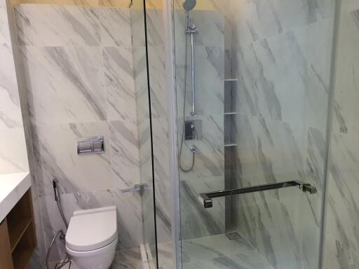 Modern bathroom with glass shower and toilet