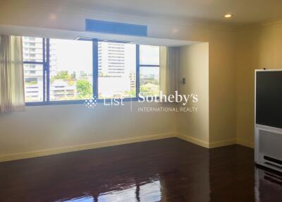 Spacious living room with large windows and natural light