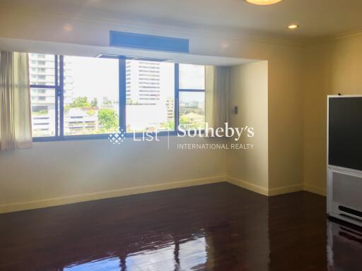 Spacious living room with large windows and natural light