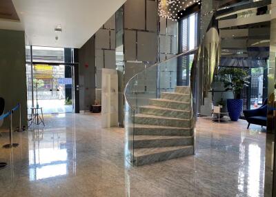 Spacious modern building lobby with marble staircase