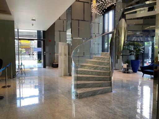 Spacious modern building lobby with marble staircase