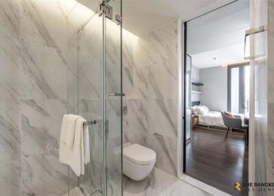 Modern bathroom with glass-enclosed shower