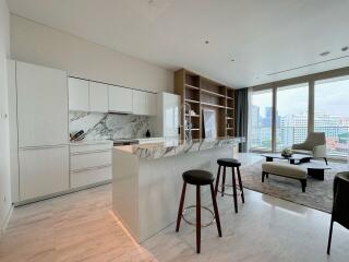 Modern kitchen and living area with city view