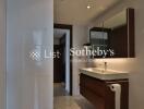 Modern bathroom with vanity and large mirror