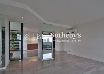 Modern living area with large mirrors and open layout