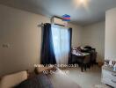 Bedroom with window, air conditioning, desk, and bed