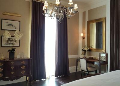 Elegant bedroom with chandelier and writing desk