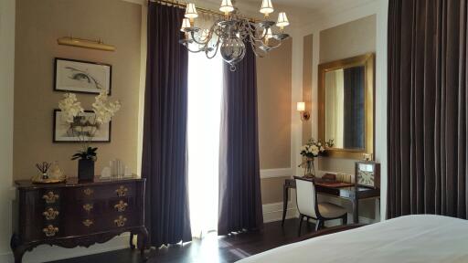 Elegant bedroom with chandelier and writing desk