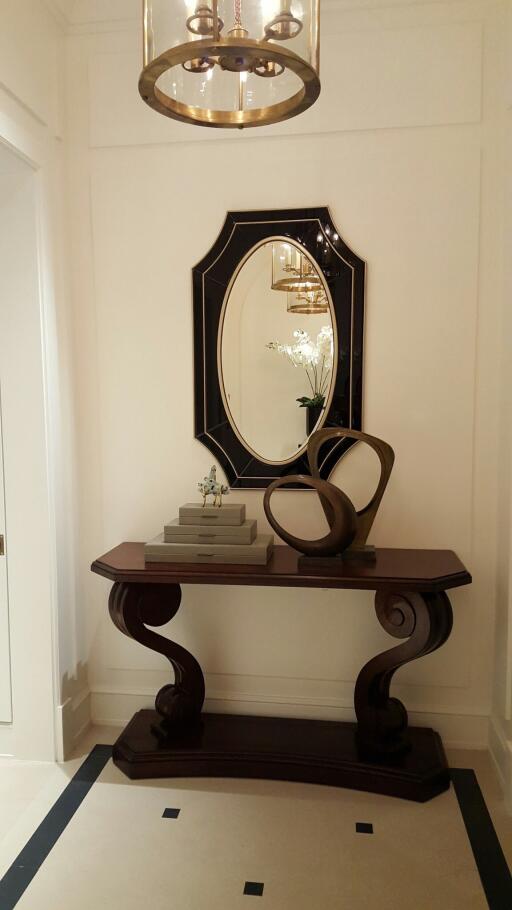 Elegant hallway with decorative table and mirror