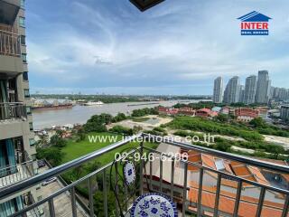 Balcony view overlooking river and cityscape