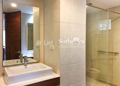 Modern bathroom with sink, mirror, and shower