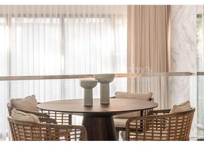 Elegant dining area with round table and comfortable chairs