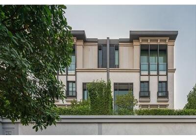 Front view of a multi-story residential building with modern architecture