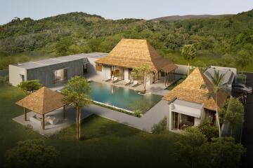 Aerial view of a luxury villa with central swimming pool and surrounding greenery