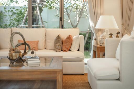 Modern living room with natural light and garden view