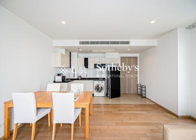 Modern dining area and kitchen with wooden flooring