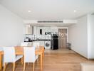 Modern dining area and kitchen with wooden flooring