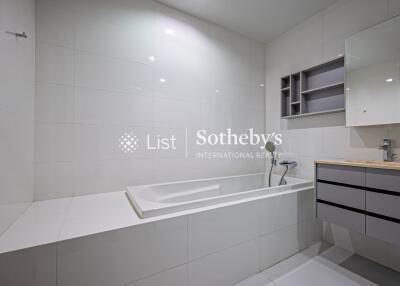 Modern bathroom with bathtub and vanity mirror