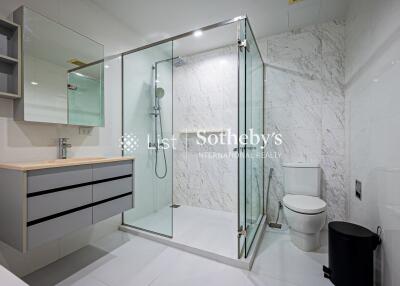 Modern bathroom with glass shower and toilet